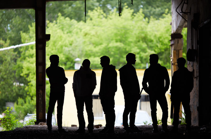 A group of people standing together in a tunnel. 